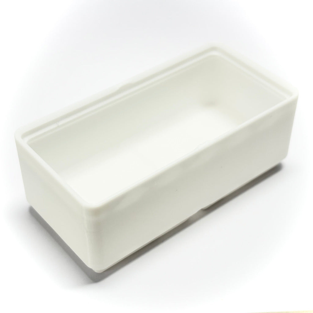 A rectangular gridfinity container with a shallow interior, shown at an angle on a white background.