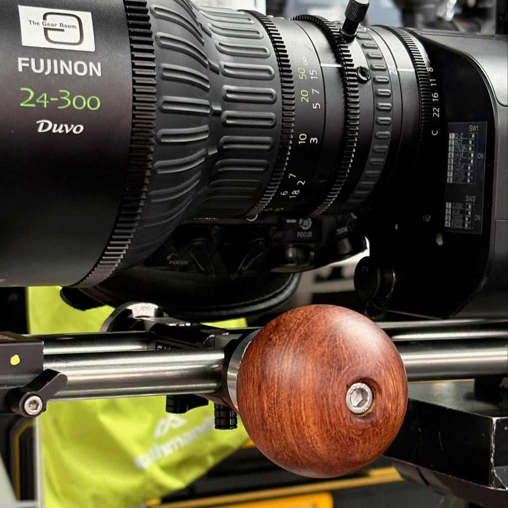 Wooden ball camera handle with a Fujinon Duvo 24-300mm lens