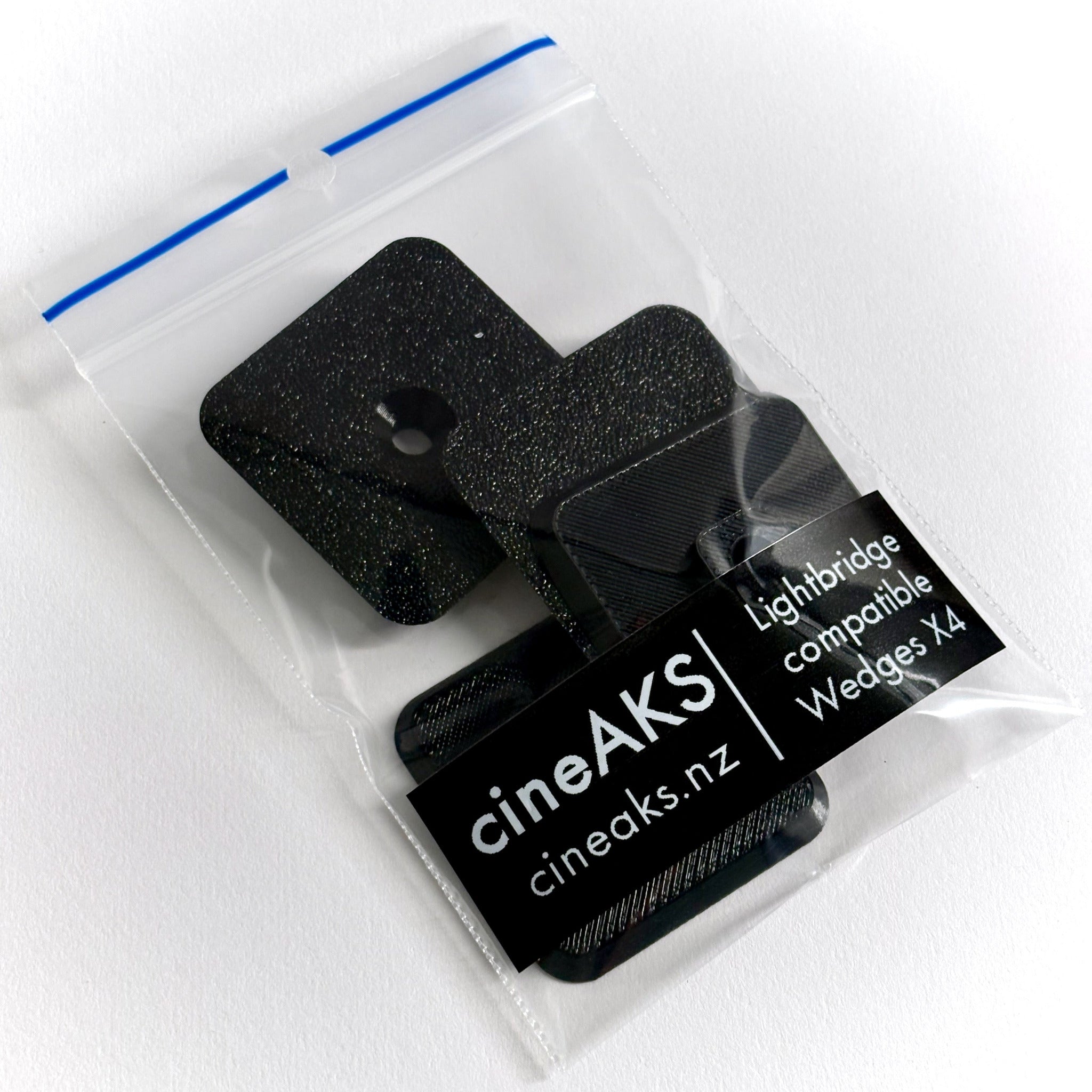 4 pack of cineAKS replacement LightBridge CLRS wedges on a white background