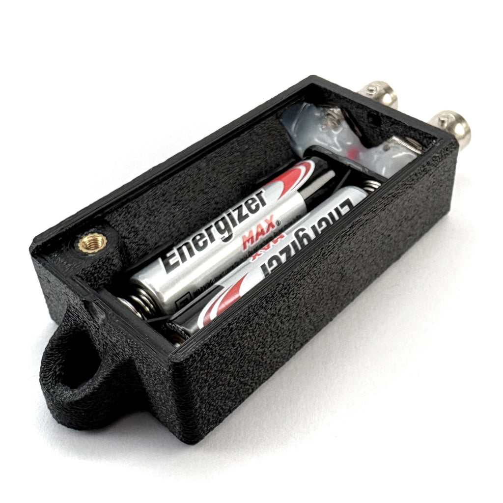 Broken SDI tester open showing batteries