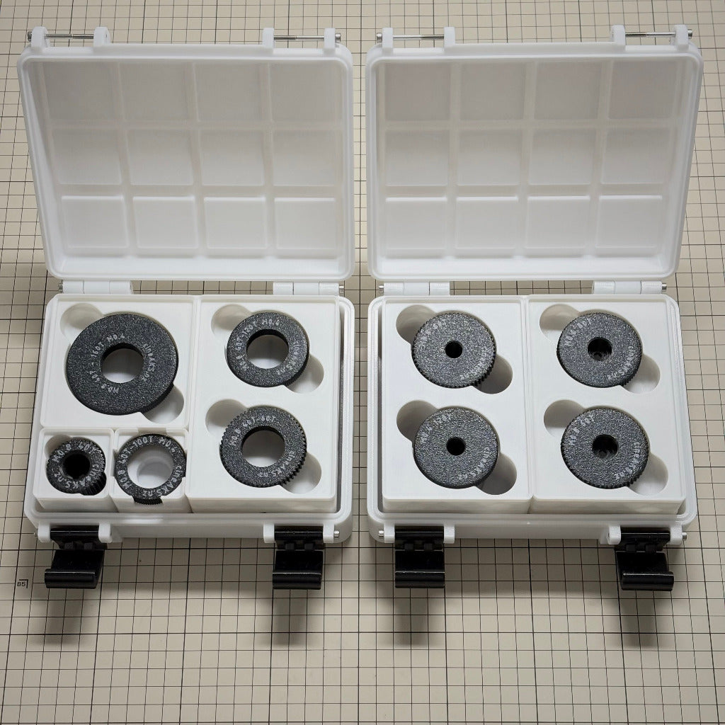 cineAKS cforce gear kits with M0.8, M0.6, M0.5 and M0.4 / 64p cinema lens gears stored in two 3x4x8U Gridfinity cases, placed on a beige grid background.