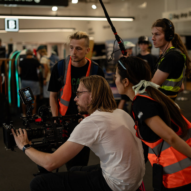 Michelle Ang and cinematographer Hendrikus De Vaan lining up a shot for a documentary at Auckalnd International Airport.