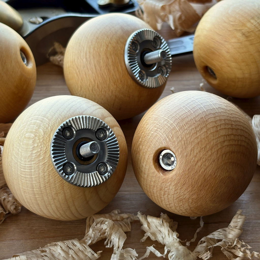 Wood ball camera grips for cinematography camera operating