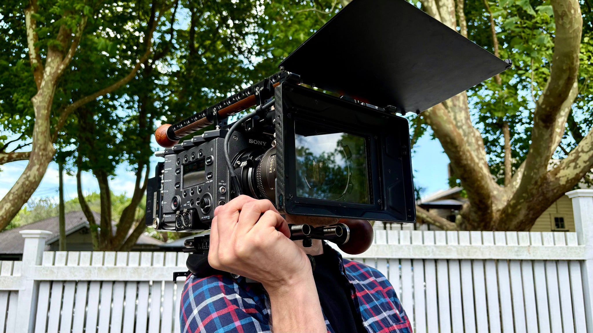 Camera operator holding a Sony Venice 2 with Alas Anaromphic lens and Wooden Camera Handle grips