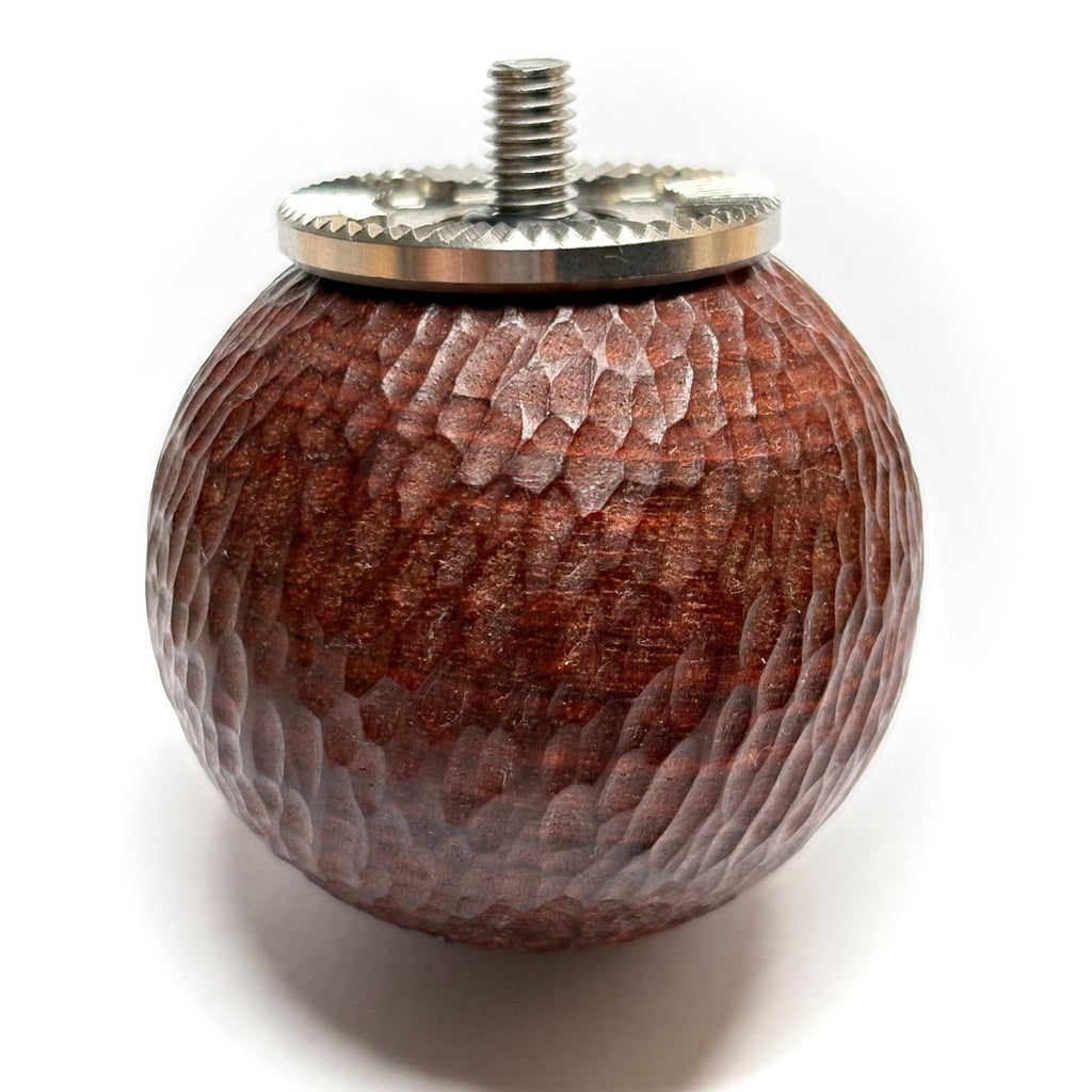 Hand carved wooden ball camera handle with metal rosette on a white background