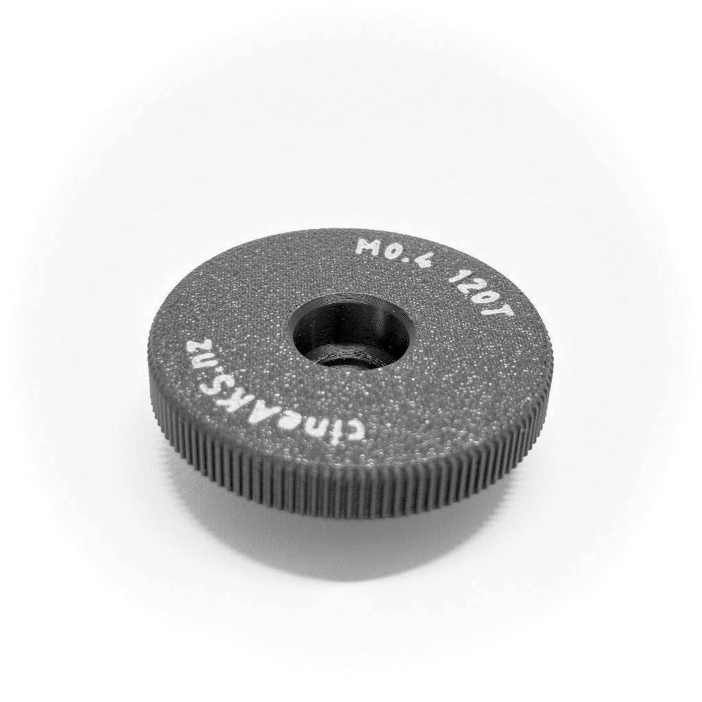 120 tooth M0.4 64 pitch lens gear for older Panavision iris mechanisms, on a white background