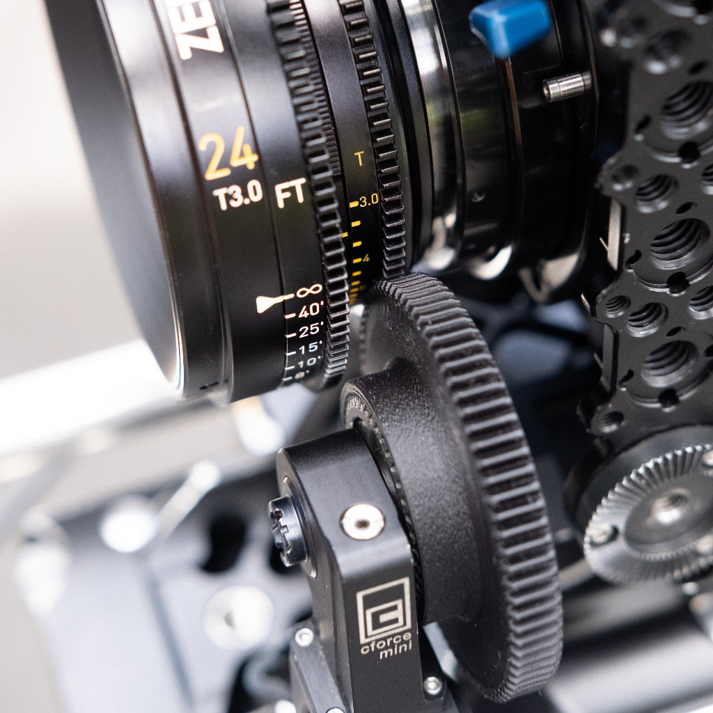 Close-up of a camera lens with 'ZeroOptik' branding on a blurred background and push on gear for cforce mini