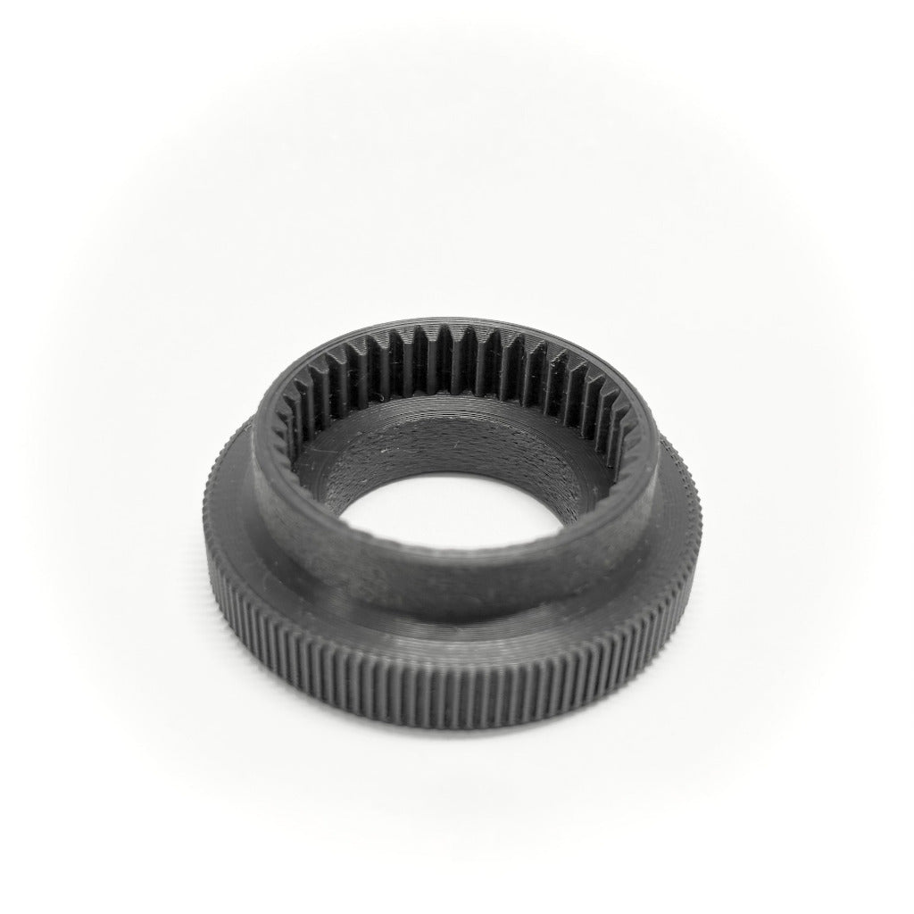 ARRI cforce Mini M0.8 to Panavision push-on focus gears and offset adapter by cineAKS, on a white background