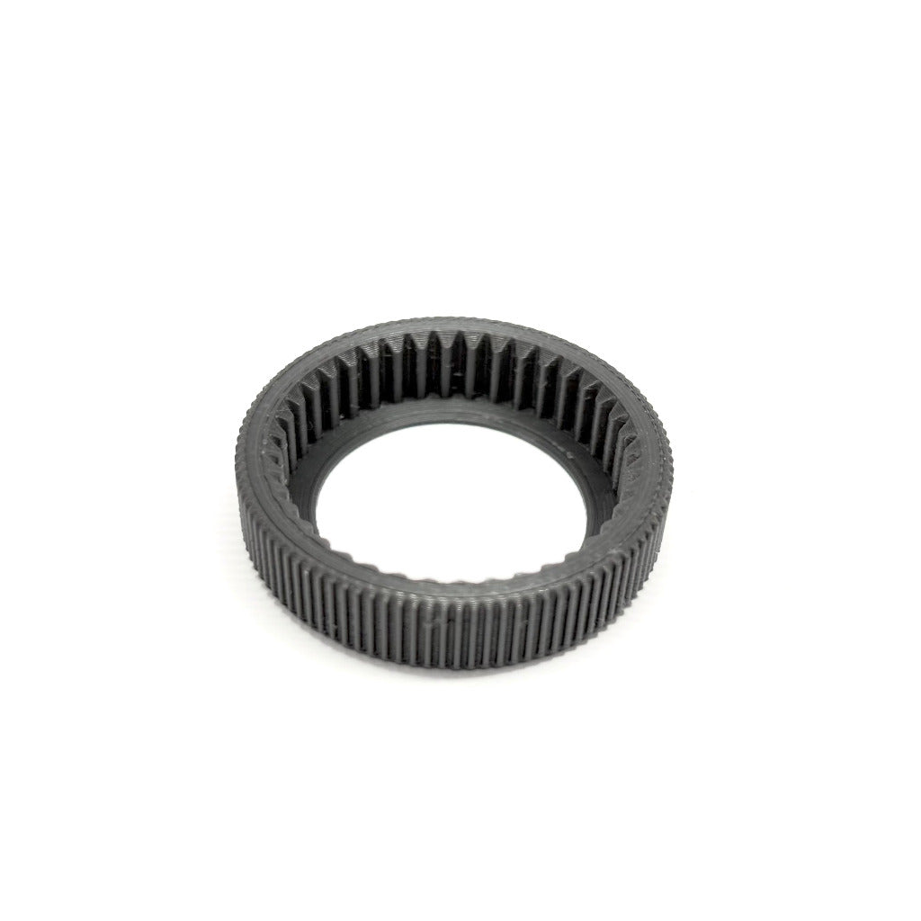 Detail shot of m0.8 40t arri gear to Panavision M0.4 100T flush push-on lens gear for ARRI cforce Mini, on a white background.