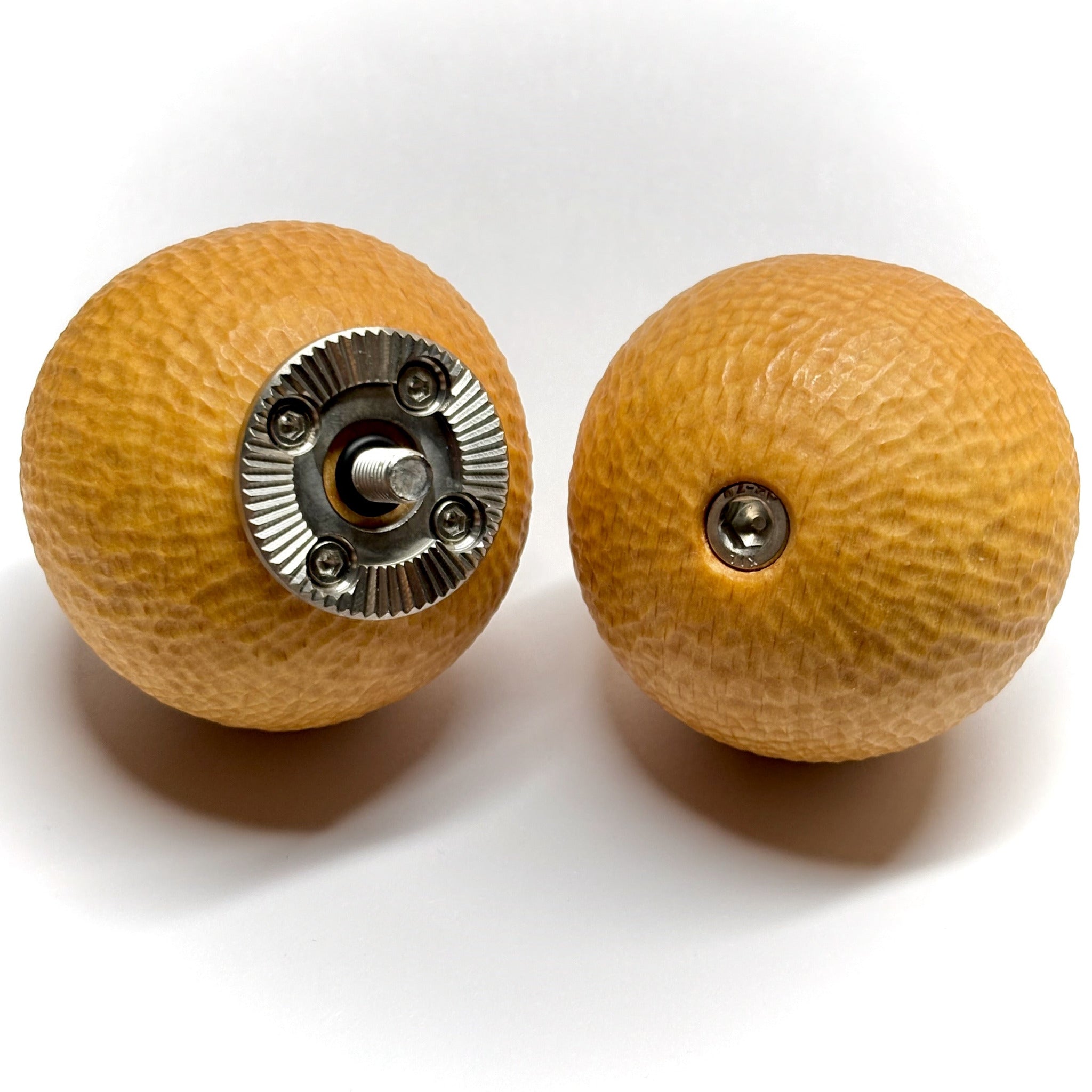Two wooden ball camera handles with metal rosettes on a white background